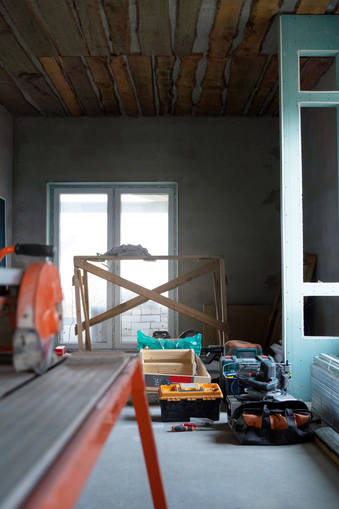 a room with tools and a wood table